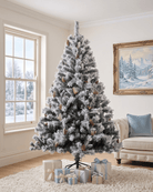 A snow flocked artificial Christmas tree stands at 7ft in a living room