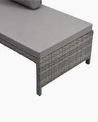 Grey wicker outdoor furniture set with cushioned seat