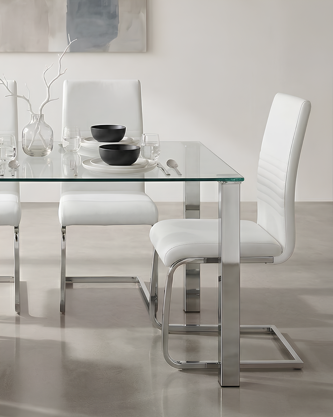 A pair of white dining chairs in a modern dining room