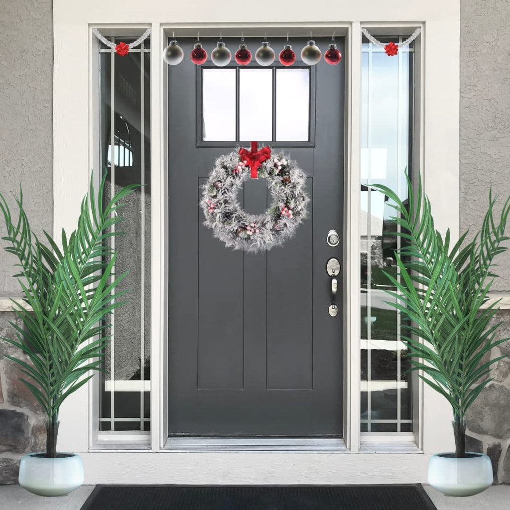 EVRE 50 cm Artificial Christmas Wreath with pine berries and snow hanging on outside door