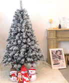 EVRE 5ft Snow Effect Pine and Berries Christmas Tree decorated in living room