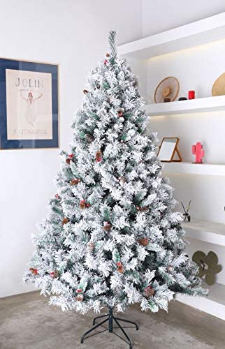 EVRE 8ft Snow Effect Pine and Berries Christmas Tree decorated in a homely living room